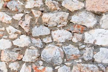 Antique stone wall. Old gray bricks background.
