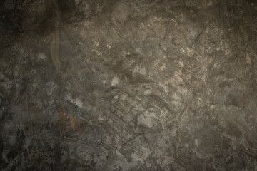 The texture of the old cement wall has abstract marks.