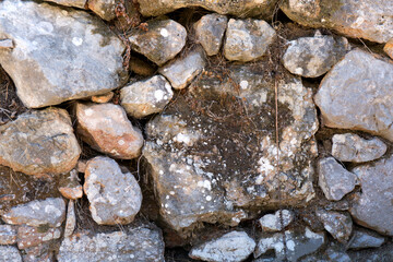 Antique stone wall. Old gray bricks background.