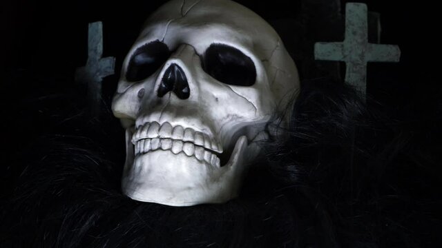 Human glowing skull on creepy background medium panning shot