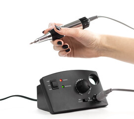 A female hand holds a nail cutter. Close up. Isolated on a white background