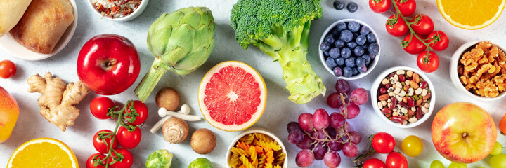 Organic vegan food panorama. Overhead shot of fruits, vegetables, legumes, mushrooms, nuts. Healthy...