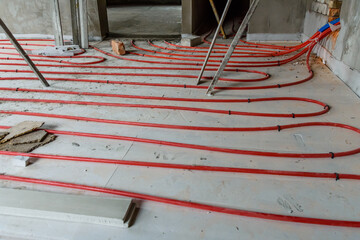 Tubes of the underfloor heating system on a styrofoam insulation