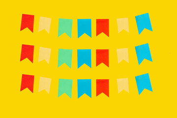 Three rows of flags on a yellow background