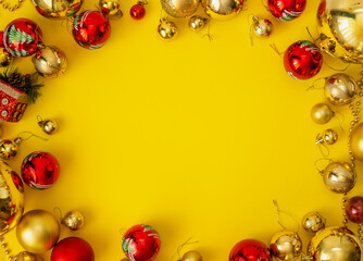 Fototapeta na wymiar frame for text from Christmas toys on a yellow background