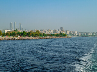 Istanbul city seashore with new urban skyscrapers. View from the sea