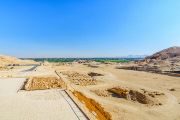 Archeological site near the temple of Hatshepsut in Luxor, Egypt. Green landscape on a background