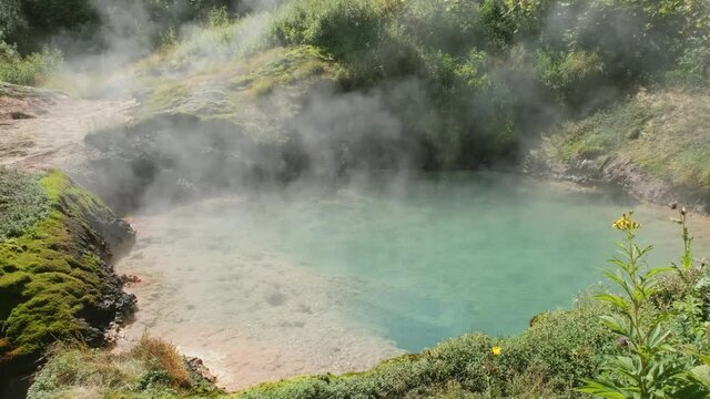 Hot lake in famous Valley of Geysers, Kamchatka peninsula, Russia, 4k