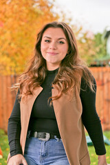Close up Portrait of 18 Years Old Beautiful, Gorgeous Girl with Long Brown hair and Big eyes, Blurry Fall Background, Happy Teenager 
