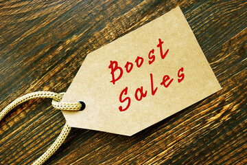 Boost Sales phrase on the piece of paper.