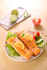 grilled salmon and lettuce in plate