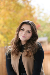 Close up Portrait of 18 Years Old Beautiful, Gorgeous Girl with Long Brown hair and Big eyes, Blurry Fall Background, Happy Teenager 