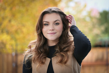 Close up Portrait of 18 Years Old Beautiful, Gorgeous Girl with Long Brown hair and Big eyes, Blurry Fall Background, Happy Teenager 