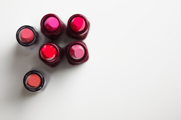 Lipsticks on white background. Top view