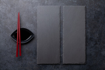 Stone plates and chopsticks for your sushi and maki © evgeeenius