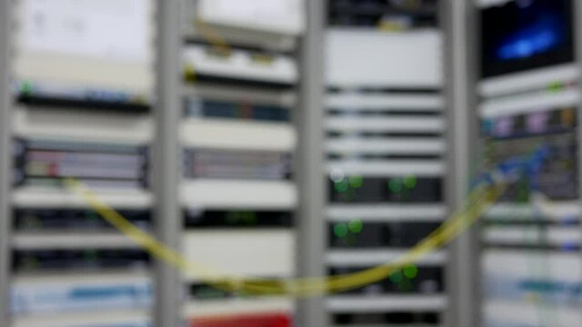 abstract blurred of servers in data center room at TV station.