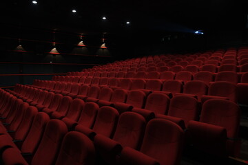 Empty cinema hall with red seats. Movie theatre