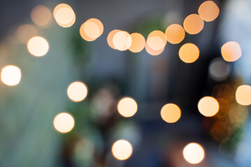 round yellow highlights from light bulbs, blurred background of Golden highlights