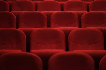 Obraz premium Empty cinema hall with red seats. Movie theatre
