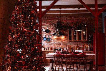 view from the living room with a Christmas tree to the kitchen and the table served for dinner