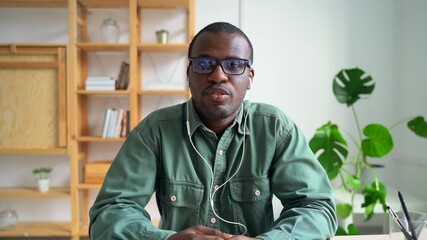 Man at virtual job interview POV Spbas. 30s millennial manager discuss work it video call. African business male wear headphone and talk about hiring or startup project