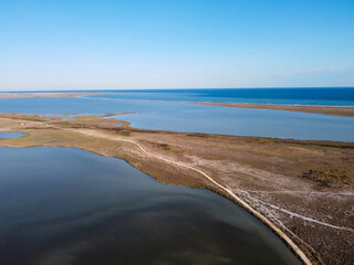 Dirt road between estuary and sea.Water flooded area in Goksu river delta,Turkey