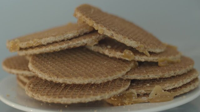 Pile on stroopwafels lying on a white plate - fast dolly