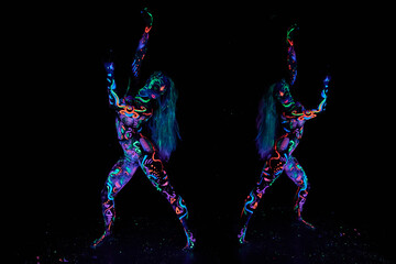 Art woman body art on the body dancing in ultraviolet light. Bright abstract drawings on the woman...