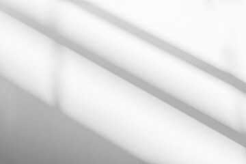 Abstract shadow and striped diagonal light background in office room  on white wall  from window, architecture dark gray and sunshine diagonal geometric effect overlay for backdrop and mockup design