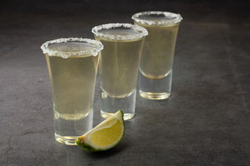 three shots of tequila with lime and space for the text.