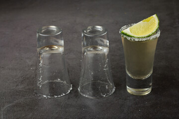 tequila glass and empty glasses.