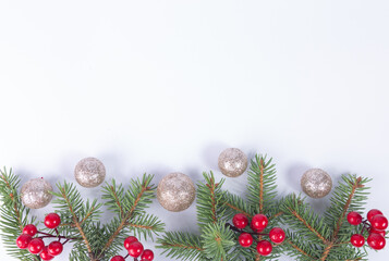 horizontal, white, festive decoration with christmas ornaments. christmas background. Christmas twigs, berries and silver balls. Copy space