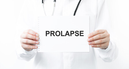 Doctor holding a card with text PROLAPSE, medical concept