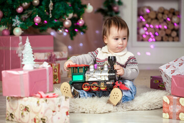 older brother gives gift to the younger. Christmas