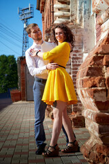 Boy and girl during walk in a city in a summer day