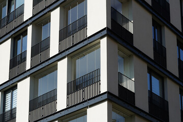 Modern residential or office building with large windows, close-up view concept