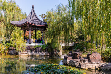 Historic & legendary Phoenix Pond & Phoenix Pavilion behind on foot of Beigu Mountain, Zhenjiang, Jiangsu, China. Tourist attraction.
