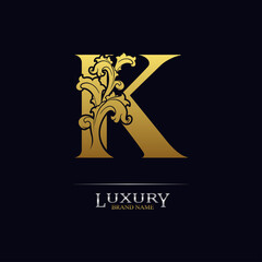 Golden initial letter K with floral leaves. Luxury Natural Logo Icon. Elegant botanic design. Modern alphabet with branch ornament for monogram, emblem, initial, label, brand, business, greeting card