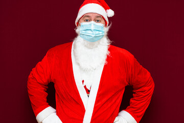 Portrait of Santa Claus man wears face mask. safe from coronavirus covid-19 during quarantine.