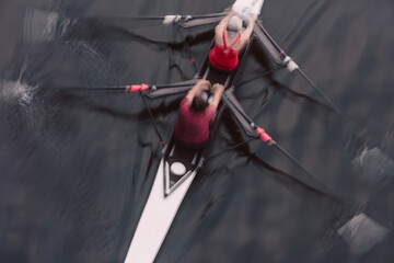 Overhead view of a double scull pair rowing together, two people.