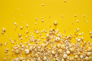 caramel popcorn on a yellow background copy sapce