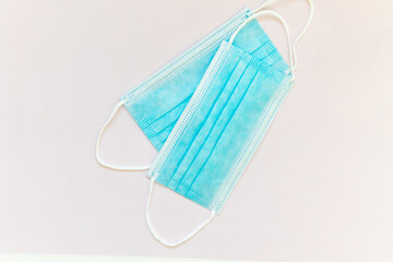 Medical surgical masks for the prevention of coronavirus Covid-19 on a pink background. Panorama of PPE.