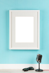 poster artwork mockup template for online shop,  picture frame with matte on turquoise wall with...