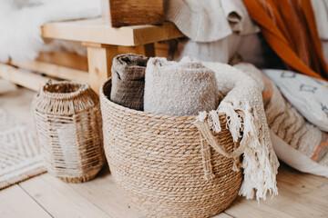 Selective focus on home decor. Comfortable bedroom in bohemian interior style