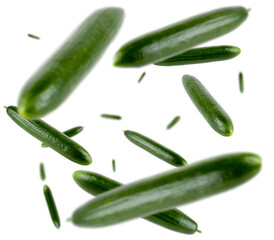 Many cucumbers free falling on white background. Selective focus - shallow depth of field.