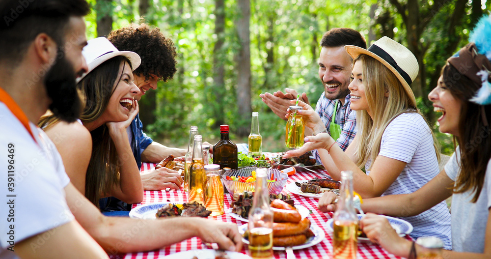 Wall mural friends making barbecue and having lunch in the nature