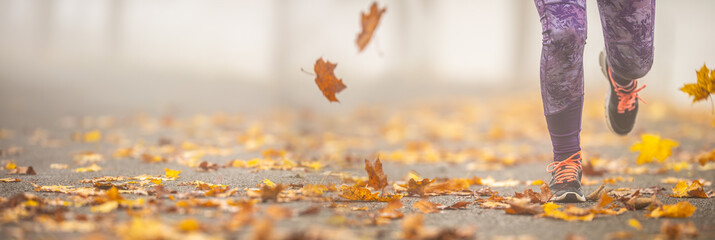 Close-up view of female legs running in autumn nature