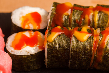 Japanese food: Set of salmon sushi and rolls with salmon and eel