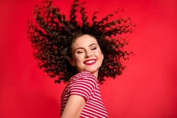 Photo of attractive young girl happy smile enjoy hair care salon treatment isolated over red color background