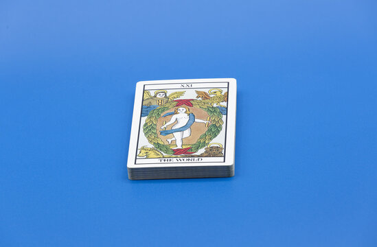 Stack Of Tarot Cards On Blue Surface